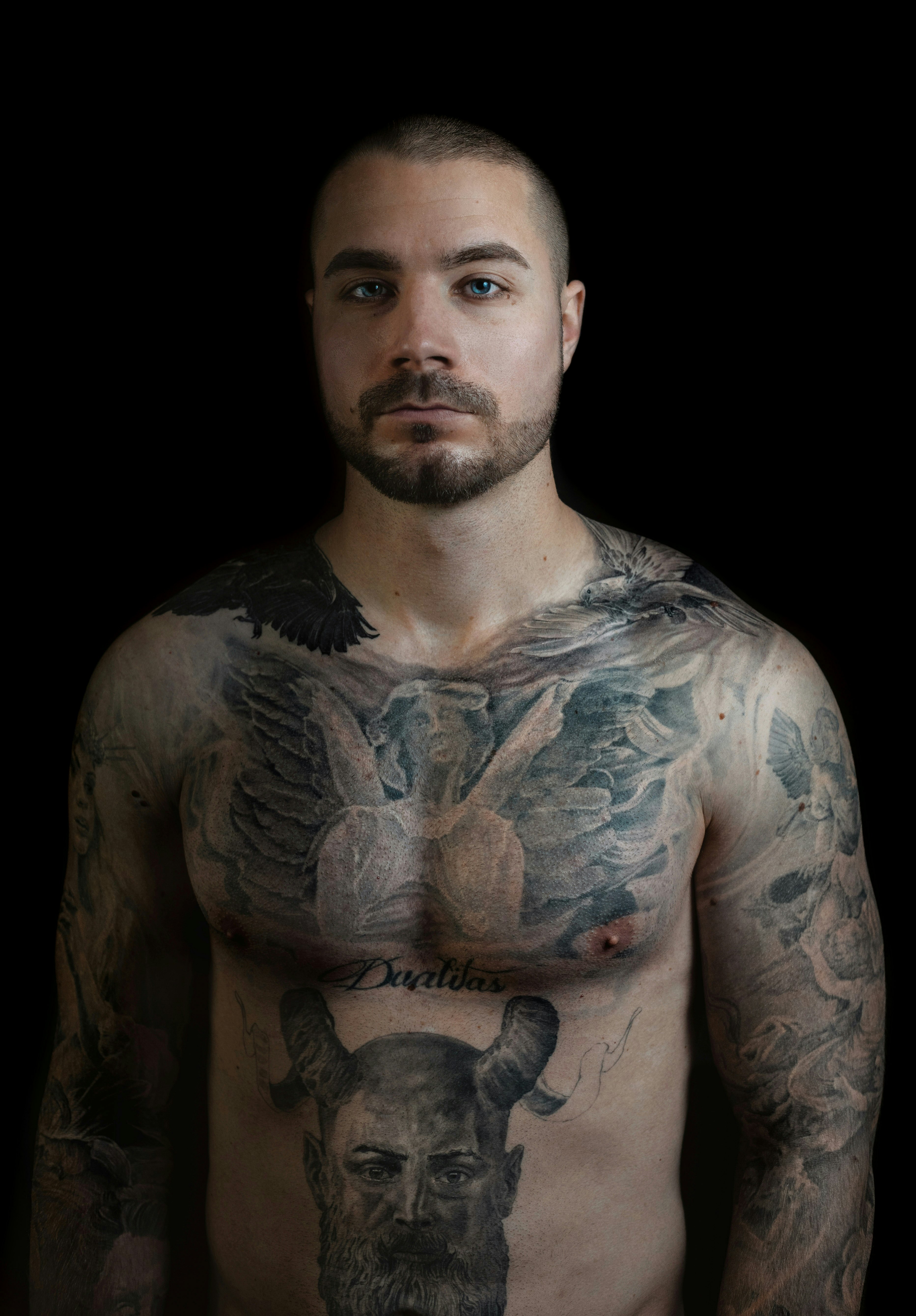 man with black and white body tattoo